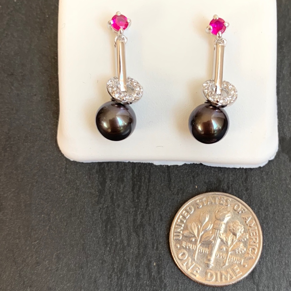 Black cultured pearl dangles with Cubic Zirconia.